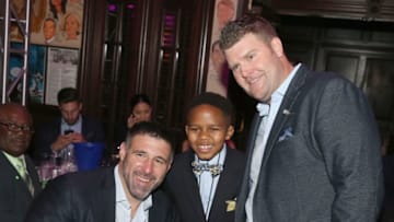 NASHVILLE, TN - APRIL 24:(L-R) Titans head coach Mike Vrabel, Make-A-Wish child Kayden and Titans GM, Jon Robinson take a photo during the 17th annual Waiting for Wishes celebrity dinner at The Palm on April 24, 2018 in Nashville, Tennessee. (Photo by Terry Wyatt/Getty Images for The Kevin Carter Foundation)