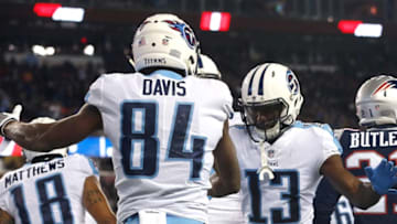 FOXBOROUGH, MA - JANUARY 13: Corey Davis #84 of the Tennessee Titans reacts with Taywan Taylor #13 after catching a touchdown pass in the first quarter of the AFC Divisional Playoff game agains the New England Patriots at Gillette Stadium on January 13, 2018 in Foxborough, Massachusetts. (Photo by Jim Rogash/Getty Images)