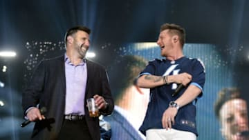 NASHVILLE, TN - APRIL 04: Tyler Hubbard (R) of multi-platinum superstar duo Florida Georgia Line performs onstage to with Titans head coach Mike Vrabel during The NFL's Tennessee Titans "Tradition Evolved" concert event in downtown Nashville to celebrate The Titans new 2018 uniforms on April 4, 2018 in Nashville, Tennessee. (Photo by John Shearer/Getty Images for Florida Georgia Line and Tennessee Titans)