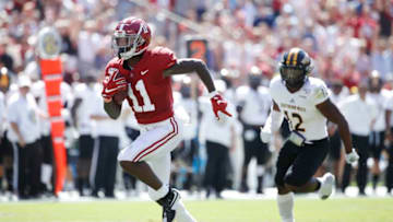 TUSCALOOSA, AL - SEPTEMBER 21: Henry Ruggs III #11 of the Alabama Crimson Tide runs for a 45-yard touchdown in the first quarter after catching a pass behind D.Q. Thomas #12 of the Southern Mississippi Golden Eagles at Bryant-Denny Stadium on September 21, 2019 in Tuscaloosa, Alabama. (Photo by Joe Robbins/Getty Images)