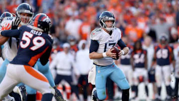DENVER, COLORADO - OCTOBER 13: Quarterback Ryan Tannehill #17 of the Tennessee Titans is chased out of the pocket against the Denver Broncos in the fourth quarter at Broncos Stadium at Mile High on October 13, 2019 in Denver, Colorado. (Photo by Matthew Stockman/Getty Images)