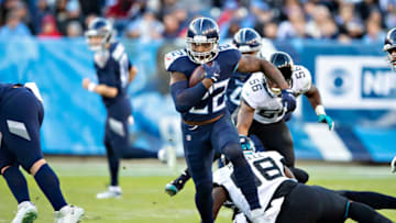 NASHVILLE, TN - NOVEMBER 24: Derrick Henry #22 of the Tennessee Titans runs the ball during the first half of a game against the Jacksonville Jaguars at Nissan Stadium on November 24, 2019 in Nashville, Tennessee. The Titans defeated the Jaguars 42-20. (Photo by Wesley Hitt/Getty Images)