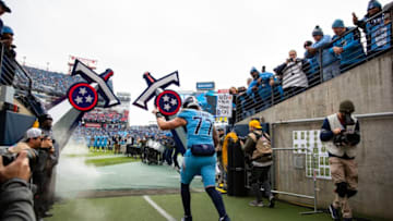 NASHVILLE, TN - DECEMBER 15: Taylor Lewan #77 of the Tennessee Titans enters the field as he exits the tunnel before the game against the Houston Texans at Nissan Stadium on December 15, 2019 in Nashville, Tennessee. Houston defeats Tennessee 24-21. (Photo by Brett Carlsen/Getty Images)
