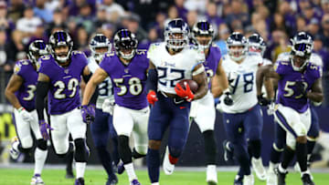 BALTIMORE, MARYLAND - JANUARY 11: Running back Derrick Henry #22 of the Tennessee Titans carries the ball against the Baltimore Ravens during the AFC Divisional Playoff game at M&T Bank Stadium on January 11, 2020 in Baltimore, Maryland. (Photo by Rob Carr/Getty Images)