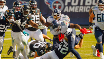 NASHVILLE, TENNESSEE - SEPTEMBER 20: Andrew Wingard #42 of the Jacksonville Jaguars tackles Derrick Henry #22 of the Tennessee Titans at Nissan Stadium on September 20, 2020 in Nashville, Tennessee. (Photo by Frederick Breedon/Getty Images)