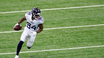 INDIANAPOLIS, INDIANA - NOVEMBER 29: Corey Davis #84 of the Tennessee Titans carries the ball in the first quarter during their game against the Indianapolis Colts at Lucas Oil Stadium on November 29, 2020 in Indianapolis, Indiana. (Photo by Andy Lyons/Getty Images)
