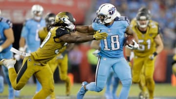 NASHVILLE, TN - OCTOBER 27: Rishard Matthews #18 of the Tennessee Titans runs with the ball while defended byJohnathan Cyprien #37 of the Jacksonville Jaguars at Nissan Stadium on October 27, 2016 in Nashville, Tennessee. (Photo by Andy Lyons/Getty Images)