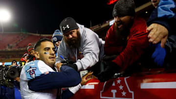 KANSAS CITY, MO - JANUARY 06: Quarterback Marcus Mariota #8 of the Tennessee Titans high-fives fans after the Titans defeated the Kansas City Chiefs 22-21 to win the AFC Wild Card playoff game at Arrowhead Stadium on January 6, 2018 in Kansas City, Missouri. (Photo by Jamie Squire/Getty Images)