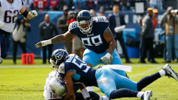NASHVILLE, TN - NOVEMBER 11: Tom Brady #12 of the New England Patriots is sacked by Wesley Woodyard #59 of the Tennessee Titans during the first quarter at Nissan Stadium on November 11, 2018 in Nashville, Tennessee. (Photo by Frederick Breedon/Getty Images)