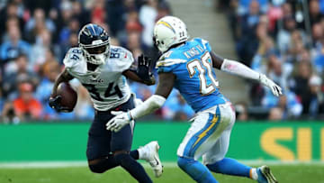 LONDON, ENGLAND - OCTOBER 21: Corey Davis #84 of the Tennessee Titans fends off Desmond King #20 of the Los Angeles Chargers during the NFL International Series game between Tennessee Titans and Los Angeles Chargers at Wembley Stadium on October 21, 2018 in London, England. (Photo by Jack Thomas/Getty Images)