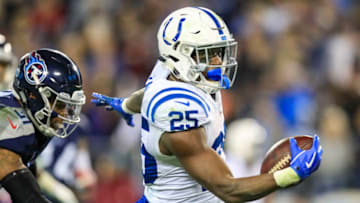 NASHVILLE, TN - DECEMBER 30: Marlon Mack #25 of the Indianapolis Colts runs with the ball while defended by Kevin Byard #31 of the Tennessee Titans during the second quarter at Nissan Stadium on December 30, 2018 in Nashville, Tennessee. (Photo by Andy Lyons/Getty Images)