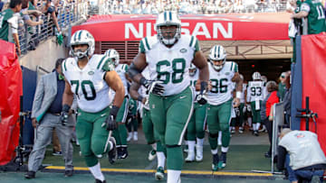 NASHVILLE, TN - DECEMBER 02: Offensive tackle Kelvin Beachum #68 and offensive guard Dakota Dozier #70 of the New York Jets runs onto the field prior to a game against the Tennessee Titans at Nissan Stadium on December 2, 2018 in Nashville, Tennessee. (Photo by Frederick Breedon/Getty Images)