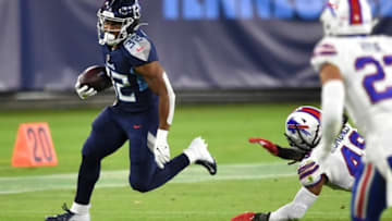 Tennessee Titans running back Darrynton Evans (32) runs past Buffalo Bills defenders during the second quarter at Nissan Stadium Tuesday, Oct. 13, 2020 in Nashville, Tenn.Gw44674
