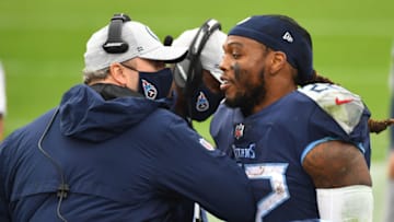 Oct 18, 2020; Nashville, Tennessee, USA; Tennessee Titans running back Derrick Henry (22) is congratulated by Tennessee Titans offensive coordinator Arthur Smith after a touchdown run during the second half against the Houston Texans at Nissan Stadium. Mandatory Credit: Christopher Hanewinckel-USA TODAY Sports