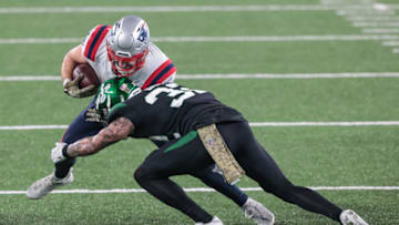 Nov 9, 2020; East Rutherford, New Jersey, USA; New England Patriots running back Rex Burkhead (34) is tackled by New York Jets cornerback Pierre Desir (35) during the second half at MetLife Stadium. Mandatory Credit: Vincent Carchietta-USA TODAY Sports