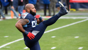 Jan 10, 2021; Nashville, Tennessee, USA; Tennessee Titans nose tackle DaQuan Jones (90) warms up before a AFC Wild Card playoff game against the Baltimore Ravens at Nissan Stadium. Mandatory Credit: Steve Roberts-USA TODAY Sports