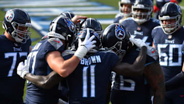 Jan 10, 2021; Nashville, Tennessee, USA; Tennessee Titans wide receiver A.J. Brown (11) celebrates with teammates after a touchdown catch against the Baltimore Ravens during the first quarter in a AFC Wild Card playoff game at Nissan Stadium. Mandatory Credit: Christopher Hanewinckel-USA TODAY Sports