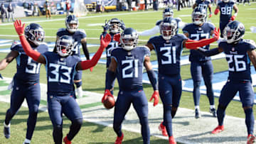 Jan 10, 2021; Nashville, Tennessee, USA;Tennessee Titans cornerback Malcolm Butler (21) and the team celebrate his interception in the first quarter during the Tennessee Titans game against the Baltimore Ravens. Mandatory Credit: George Walker IV/The Tennessean via USA TODAY Sports