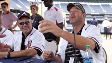 Aug 9, 2015; Atlanta, GA, USA; Atlanta Braves former second baseman Mark Lemke and former starting pitcher Kevin Millwood sign autographs before a game against the Miami Marlins at Turner Field. Mandatory Credit: Brett Davis-USA TODAY Sports