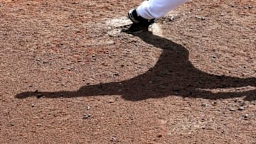 Mar 16, 2016; Lake Buena Vista, FL, USA; The shadow of Atlanta Braves relief pitcher Kyle Kinman on the mound as he pitches against the St. Louis Cardinals during the seventh inning at Champion Stadium. Mandatory Credit: Butch Dill-USA TODAY Sports