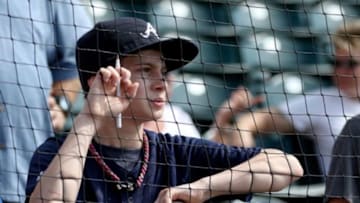 Mar 15, 2015; Lake Buena Vista, FL, USA; A young Atlanta Braves fan tries to get an autograph before a spring training baseball game against the Toronto Blue Jays at Champion Stadium. Mandatory Credit: Reinhold Matay-USA TODAY Sports