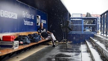Mar 19, 2016; Tampa, FL, USA; Atlanta Braves pitching coach Roger McDowell (45) sits in the dugout in the rain before the game between the New York Yankees and the Braves at George M. Steinbrenner Field. Mandatory Credit: Jerome Miron-USA TODAY Sports