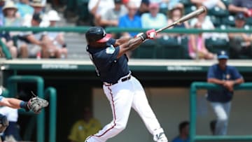 Apr 1, 2016; Lake Buena Vista, FL, USA; Atlanta Braves third baseman Adonis Garcia (13) singles during the fourth inning against the Tampa Bay Rays at Champion Stadium. Mandatory Credit: Kim Klement-USA TODAY Sports