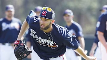 Feb 22, 2016; Lake Buena Vista, FL, USA; Atlanta Braves pitcher Chris Ellis fields the ball during spring training workouts at ESPN