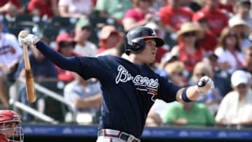 Mar 11, 2016; Jupiter, FL, USA; Atlanta Braves designated hitter Reid Brignac (4) connects for a 2 run home run against the St. Louis Cardinals during the game at Roger Dean StadiumThe Cardinals defeated the Braves 4-3. Mandatory Credit: Scott Rovak-USA TODAY Sports