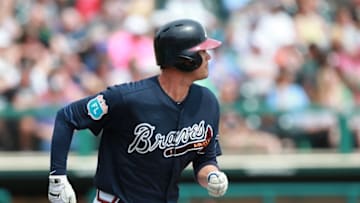 Mar 18, 2016; Lake Buena Vista, FL, USA; Atlanta Braves shortstop Reid Brignac (4) hits a RBI double during the fourth inning against the Miami Marlins at Champion Stadium. Mandatory Credit: Kim Klement-USA TODAY Sports