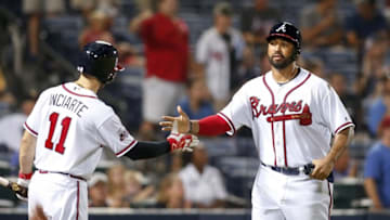 Aug 4, 2016; Atlanta, GA, USA; Atlanta Braves center fielder Ender Inciarte (11) congratulates left fielder Matt Kemp (27) on scoring a run against the Pittsburgh Pirates in the eighth inning at Turner Field. Mandatory Credit: Brett Davis-USA TODAY Sports