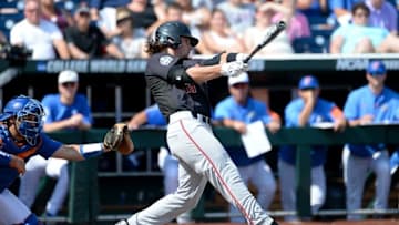 Jun 21, 2016; Omaha, NE, USA; Texas Tech Red Raiders outfielder Tyler Neslony (10) singles in the second inning against the Florida Gators in the 2016 College World Series at TD Ameritrade Park. Mandatory Credit: Steven Branscombe-USA TODAY Sports