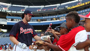 Aug 31, 2016; Atlanta, GA, USA; Atlanta Braves shortstop Dansby Swanson (2) signs autographs for fans before a game against the San Diego Padres at Turner Field. Mandatory Credit: Jason Getz-USA TODAY Sports