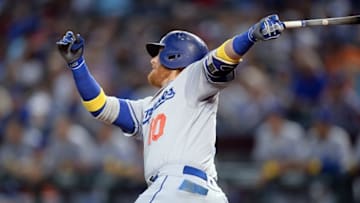 Sep 17, 2016; Phoenix, AZ, USA; Los Angeles Dodgers third baseman Justin Turner (10) hits a sacrifice fly RBI during the first inning against the Arizona Diamondbacks at Chase Field. Mandatory Credit: Joe Camporeale-USA TODAY Sports