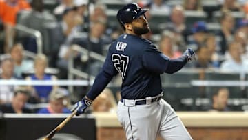 Sep 20, 2016; New York City, NY, USA; Atlanta Braves left fielder Matt Kemp (27) hits an RBI single against the New York Mets during the sixth inning at Citi Field. Mandatory Credit: Brad Penner-USA TODAY Sports