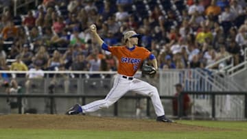 Jun 20, 2015; Omaha, NE, USA; Florida Gators pitcher Taylor Lewis (16) throws against the Virginia Cavaliers in the sixth inning at the 2015 College World Series at TD Ameritrade Park. Virginia won 5-4. Mandatory Credit: Bruce Thorson-USA TODAY Sports