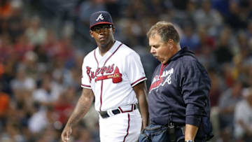 Sep 30, 2016; Atlanta, GA, USA; Atlanta Braves starting pitcher Tyrell Jenkins (61) walks off the field with assistant athletic trainer Jim Lovell after an injury against the Detroit Tigers in the eighth inning at Turner Field. Mandatory Credit: Brett Davis-USA TODAY Sports