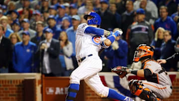 Oct 7, 2016; Chicago, IL, USA; Chicago Cubs second baseman Javier Baez (9) hits a home run against the San Francisco Giants during the eighth inning during game one of the 2016 NLDS playoff baseball series at Wrigley Field. Mandatory Credit: Jerry Lai-USA TODAY Sports
