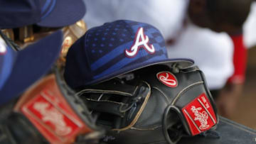 Jul 4, 2015; Atlanta, GA, USA; A detailed view of Atlanta Braves 4th of July hat and a glove in the dugout against the Philadelphia Phillies in the second inning at Turner Field. Mandatory Credit: Brett Davis-USA TODAY Sports