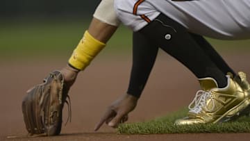 Sep 2, 2016; Baltimore, MD, USA; Baltimore Orioles third baseman Manny Machado (13) writes on the infield dirt before the game against the New York Yankees at Oriole Park at Camden Yards. Mandatory Credit: Tommy Gilligan-USA TODAY Sports