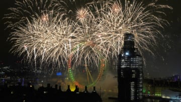 LONDON, ENGLAND - JANUARY 01: Fireworks explode over Westminster Abbey and Elizabeth Tower near Parliament as thousands of revelers gather along the banks of the River Thames to ring in the New Year on January 1, 2019 in London, England. Parliament confirmed that after being silenced for renovation work since 2017, Big Ben's famous bongs would ring out at midnight again to welcome in 2019. (Photo by Leon Neal/Getty Images)