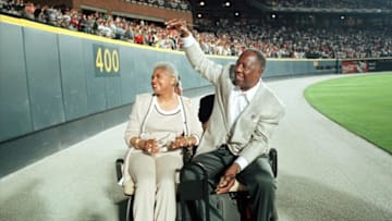 Hank Aaron and his wife Billy before a 1999 ceremony. (Photo by STEVE SCHAEFER/AFP via Getty Images)