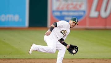OAKLAND, CA - AUGUST 07: Josh Donaldson #20 of the Oakland Athletics in action during their game against the Minnesota Twins at O.co Coliseum on August 7, 2014 in Oakland, California. (Photo by Ezra Shaw/Getty Images)