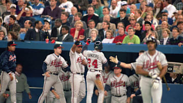 TORONTO - OCTOBER 20: Deion Sanders #24 of the Atlanta Braves receives congratulations from teammates after scoring during Game three of the 1992 World Series against the Toronto Blue Jays at Skydome on October 20, 1992 in Toronto, Ontario, Canada. The Blue Jays defeated the Braves 3-2. (Photo by Rick Stewart/Getty Images)