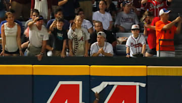 ATLANTA, GA - JUNE 24: Hall of Famer Hank Aaron prepares to pull the number 44 down from the left field wall to show that there are 43 games remaining at Turner Field after the fifth inning between the Atlanta Braves and the New York Mets on June 24, 2016 in Atlanta, Georgia. (Photo by Kevin C. Cox/Getty Images)
