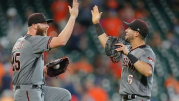 HOUSTON, TX - AUGUST 17: Archie Bradley #25 of the Arizona Diamondbacks high fives David Peralta #6 after the final out of the game against the Houston Astros at Minute Maid Park on August 17, 2017 in Houston, Texas. (Photo by Bob Levey/Getty Images)