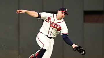 ATLANTA, GA - SEPTEMBER 30: Adam Duvall #14 of the Atlanta Braves makes a catch against the Philadelphia Phillies during the third inning at Truist Park on September 30, 2021 in Atlanta, Georgia. (Photo by Adam Hagy/Getty Images)