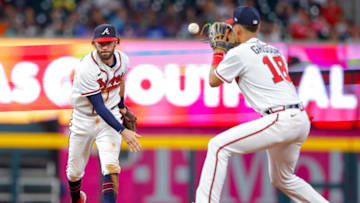 ATLANTA, GA - AUGUST 16: Dansby Swanson #7 tosses to Vaughn Grissom #18 of the Atlanta Braves during the ninth inning against the New York Mets at Truist Park on August 16, 2022 in Atlanta, Georgia. (Photo by Todd Kirkland/Getty Images)