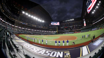 ARLINGTON, TEXAS - OCTOBER 18: The Los Angeles Dodgers stand for the national anthem prior to Game Seven of the National League Championship Series against the Atlanta Braves at Globe Life Field on October 18, 2020 in Arlington, Texas. (Photo by Tom Pennington/Getty Images)