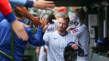 CHICAGO, ILLINOIS - JULY 17: Ian Happ #8 of the Chicago Cubs celebrates in the dugout with teammates after scoring in the fourth inning against the New York Mets at Wrigley Field on July 17, 2022 in Chicago, Illinois. (Photo by Chase Agnello-Dean/Getty Images)
